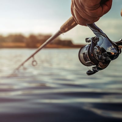 Closeup fishing rod with lake background