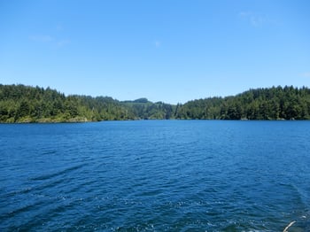 Blue lake with mountains in background