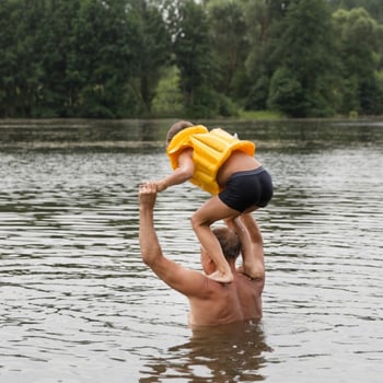 Dad and daughter in lake