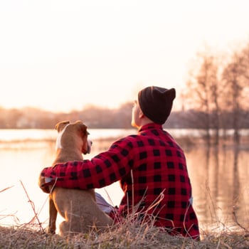 Dog and owner on lake